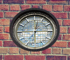 Fototapeta na wymiar Clock on brick wall