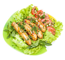 sausage with lettuce leaves, isolated on white background