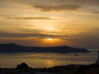Sunset over the new Volcano at Santorini Greece