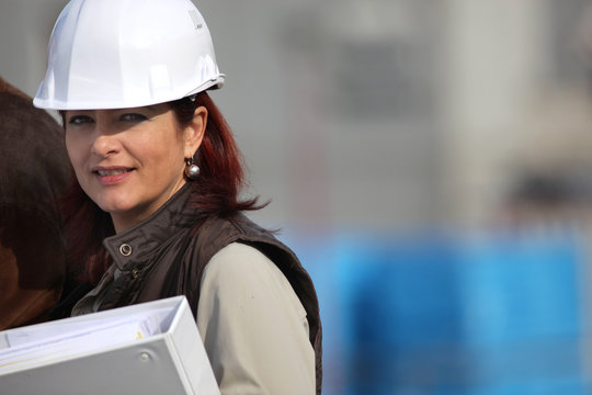 Female architect in charge of construction - Powered by Adobe