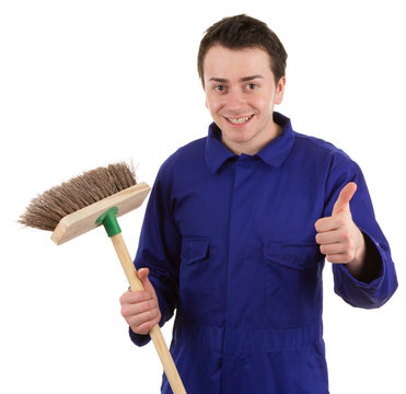 A Worker Holding A Broom