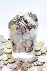 Coins in jar glass