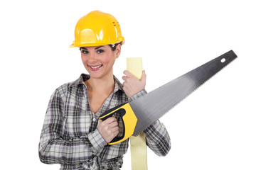 Female carpenter with saw