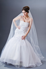 Fototapeta premium Bride in wedding dress in studio shooting