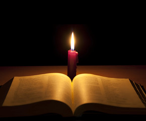 Fototapeta premium bible and candle in night