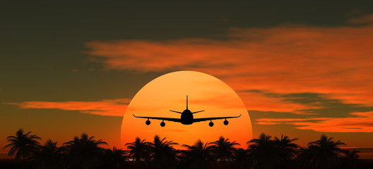 airplane flying at sunset over the tropical land with palm trees © annkozar