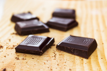 Chopped chocolate  on wooden chopping board