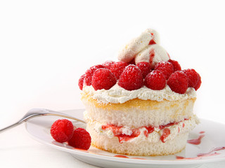Raspberry and whip cream cupcakes on white