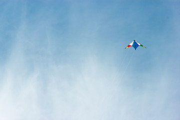 colorful kite flying in a nice blue sky