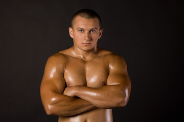 Fototapeta na wymiar Muscled male model bodybuilder