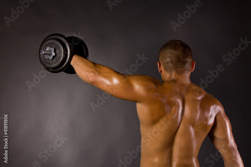 Muscled Male Bodybuilder Dumbbell Swing Stock Photo And