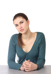 Closeup portrait of  young woman sitting at the desk