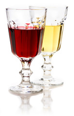Glasses of red and white wine with reflection.