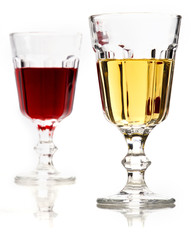 Glasses of white and red wine with reflection.