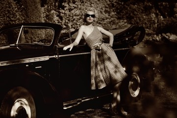 Woman near a retro car outdoors