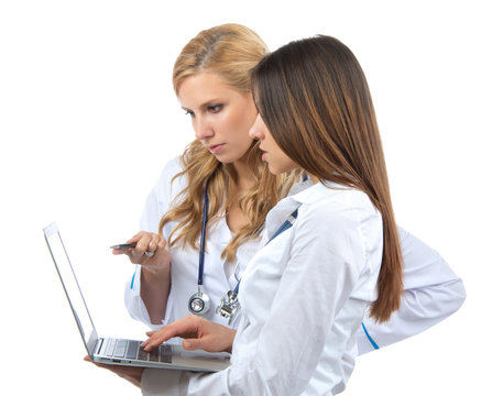 Two woman doctor and nurse research and hold laptop computer