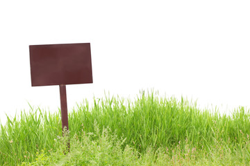 Blank billboard on green grass