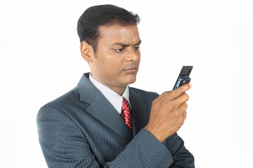 Depressed Indian Businessman with Mobile