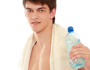 A young sportsman with a bottle of water, isolated on white