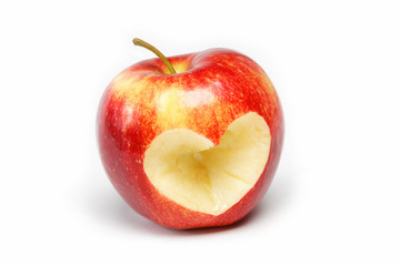 Red apple with a heart symbol against white background