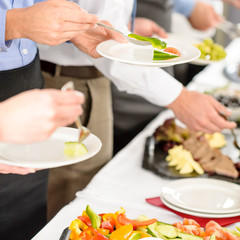 Obraz na płótnie Canvas Business catering people take buffet food