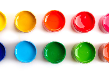 Paint buckets over white background