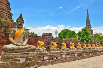 Ancient buddha statues with blue sky, Thailand