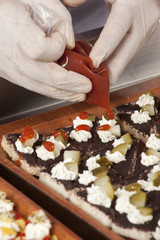 chef garnishing canapes