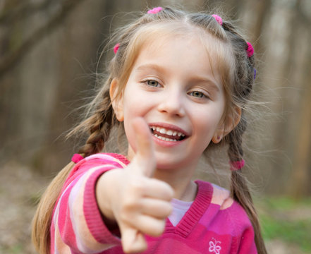 girl showing a thumbs up