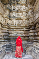A women in red sari, Khajuraho Temples, India.