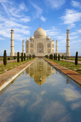 Taj Mahal at sunrise, reflecting in the pond, India