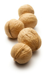 Heap of walnuts on white
