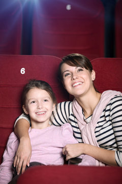 Mother and child at the cinema