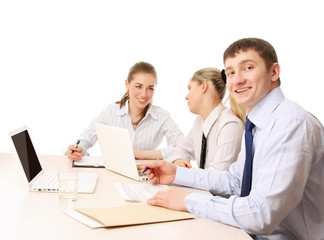 A businessgroup working at the table, isolated on white