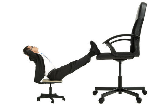 Businessman Sitting On The Small Chair Leg On The Big Chair