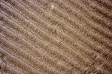 Fototapeta na wymiar Dry sand surface with waves