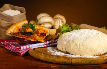 delicious pizza dough, spices and vegetables
