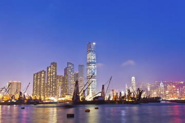 Fototapeta na wymiar Hong Kong harbor at sunset with industrial ships