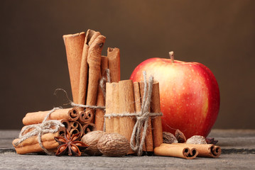 Cinnamon sticks,red apple, nutmeg,and anise