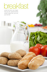 Healthy breakfast - milk, bread and tomatoes on white background
