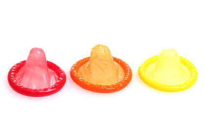 Colorful condoms isolated on white