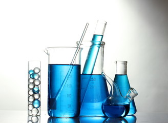 Test-tubes with blue liquid isolated on white