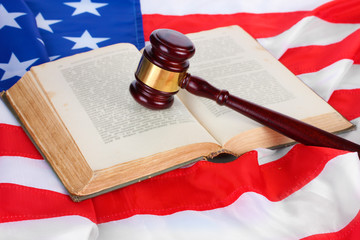 judge gavel and book on american flag background