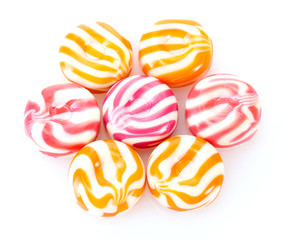striped fruit candies isolated on white