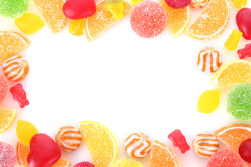 frame of colorful jelly candies isolated on white