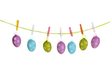 Colorful easter eggs hanging on ribbons isolated on white