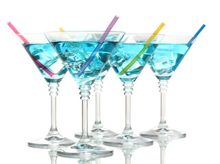Blue cocktail in martini glasses isolated on white