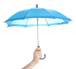 Blue umbrella in hand isolated on white