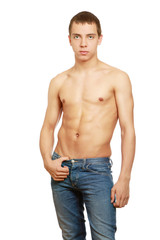 Fototapeta premium A muscular man standing isolated on white