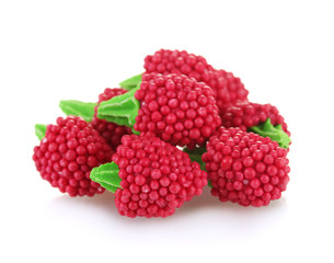 red candy raspberries isolated on white